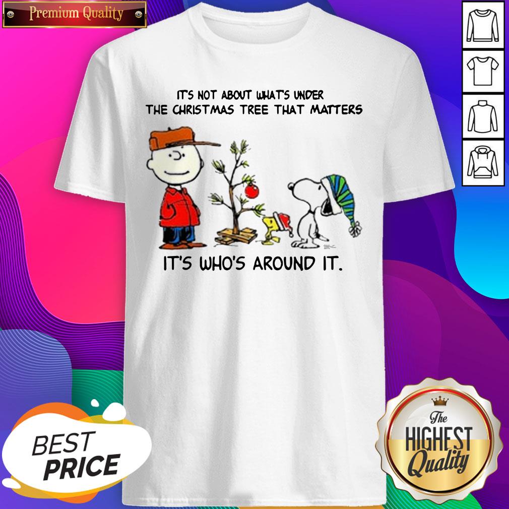 the-peanuts-snoopy-its-not-about-whats-under-the-christmas-tree-that-matters-its-whos-around-it-shirt.jpg