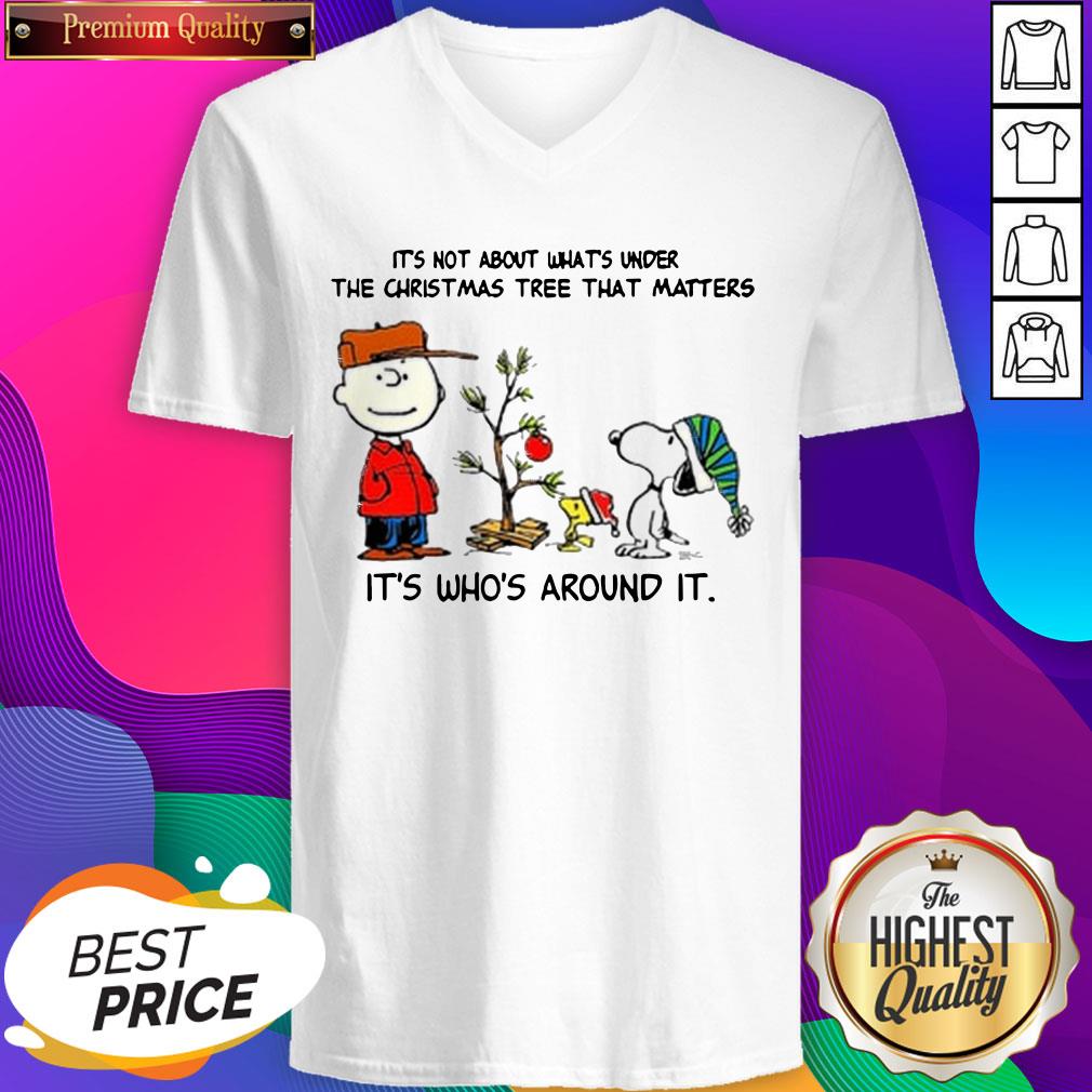 the-peanuts-snoopy-its-not-about-whats-under-the-christmas-tree-that-matters-its-whos-around-it-v-neck.jpg