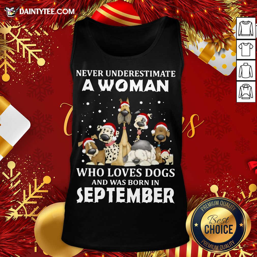 pretty-never-underestimate-a-woman-who-loves-dogs-and-was-born-in-september-christmas-tank-top.jpg