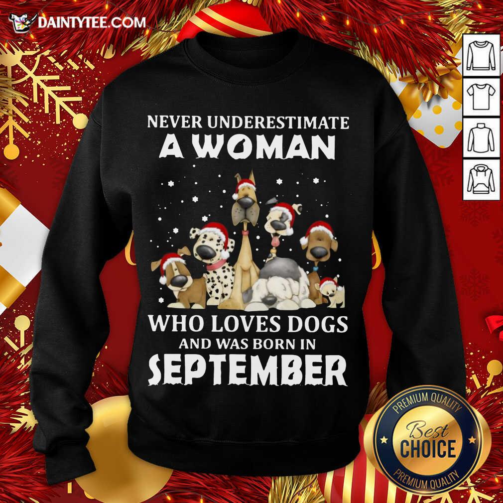 pretty-never-underestimate-a-woman-who-loves-dogs-and-was-born-in-september-christmassweatshirt.jpg