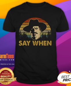 Awesome Say When Cowboy Sunset Vintage T-Shirt featuring a rustic cowboy scene against a vibrant sunset backdrop.