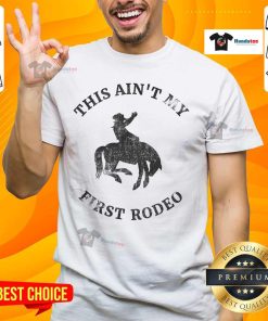 Alt Text: Awesome This Ain't My First Rodeo Bronc Horse Riding Cowboy T-Shirt featuring a bold graphic design for rodeo fans.