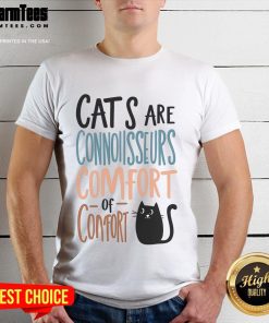 Cute cat wearing a 'Connoisseurs Comfort' T-shirt, showcasing playful feline fashion and cozy style for cat lovers.