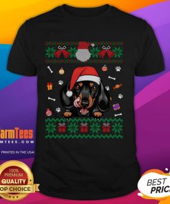 Cute Dachshund dog wearing an ugly Christmas Santa hat on a festive Xmas t-shirt, perfect for holiday celebrations.