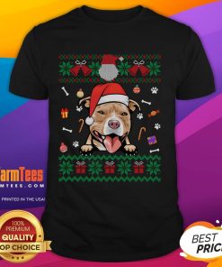 Cute Pitbull dog wearing an ugly Christmas Santa hat on a festive Xmas T-shirt, perfect for holiday celebrations.