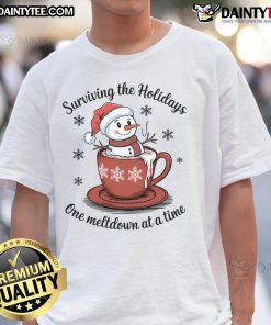 Adorable Christmas snowman design on a T-shirt reading 'Surviving The Holidays One Meltdown At A Time' with hot cocoa.