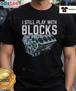 Funny mechanic I still play with blocks car engine T-shirt design featuring playful graphics and bold text.