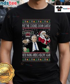 Funny Christmas T-Shirt featuring Santa with 'Put The Cookies Down, We're Making America Healthy Again' slogan.
