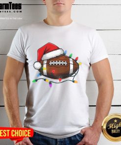 Christmas football player wearing a Santa hat on a T-shirt, celebrating the holiday spirit with festive sportswear.