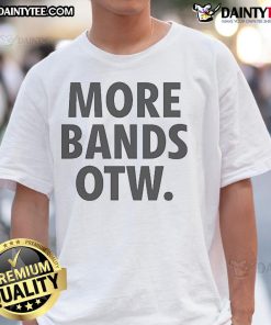 Alt Text: Official Lost Boys X Conglomerate More Bands Otw T-Shirt featuring vibrant graphics and stylish design for music lovers.