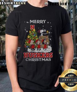 Official Nebraska Cornhuskers Snoopy and Friends Merry Christmas T-Shirt featuring festive designs and team spirit.