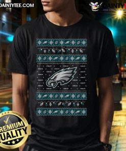 Official Philadelphia Eagles Holiday Christmas T-Shirt featuring festive design and team logo for fans celebrating the season.