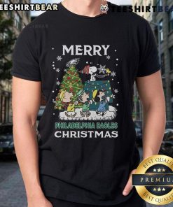 Official Snoopy and Friends Philadelphia Eagles Merry Christmas 2024 T-Shirt featuring festive graphics and team spirit.