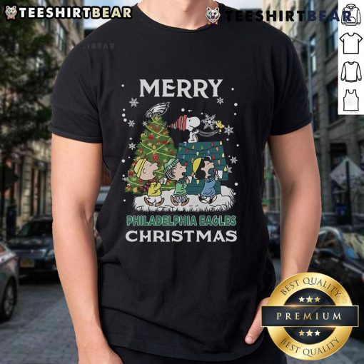 Official Snoopy and Friends Philadelphia Eagles Merry Christmas 2024 T-Shirt featuring festive graphics and team spirit.
