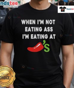 Alt Text: Official When I'M Not Eating Ass I'M Eating At Chili'S T-Shirt featuring bold text and playful design for food enthusiasts.