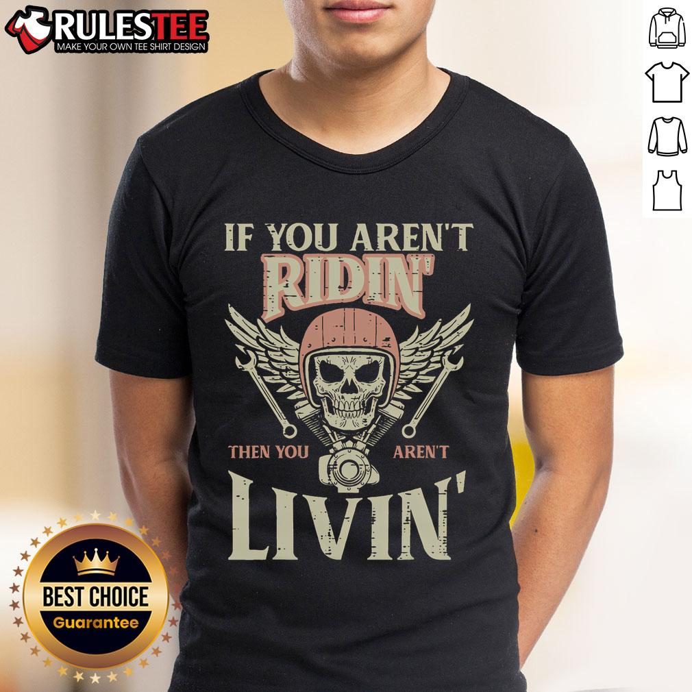 Awesome Biker If You Aren'T Ridin Livin Motorcycle T Shirt Awesome biker wearing 'If You Aren't Ridin, You're Livin' motorcycle T-shirt, showcasing passion for biking culture.