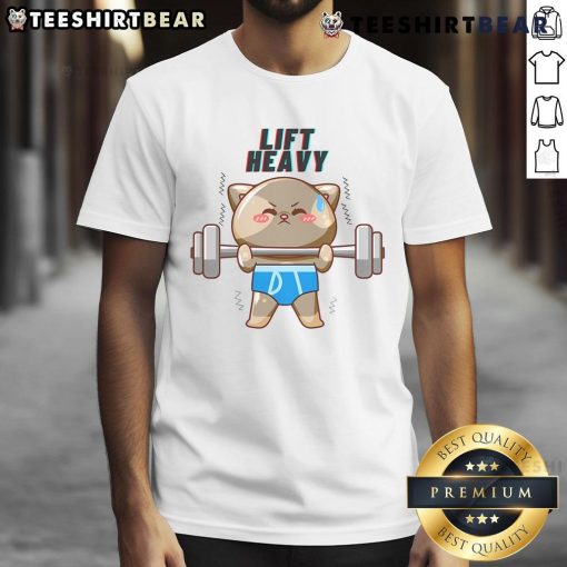 Adorable cat powerlifting on a lift heavy t-shirt, showcasing a fun and playful design for cat lovers and fitness enthusiasts.