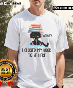 Cute cat graphic on 'What Cat Books I Closed My Book To Be Here' T-Shirt, perfect for cat lovers and book enthusiasts.