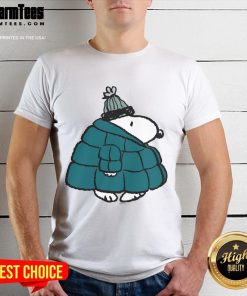 Alt Text: Cute Peanuts Snoopy winter puffer jacket poster design on a stylish t-shirt for fans of classic cartoons.
