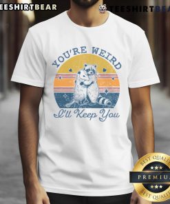 Cute 'You're Weird I'll Keep You' sunset t-shirt featuring vibrant colors and a playful design, perfect for casual wear.