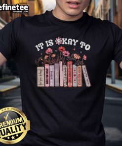 Good Mental Health It's Ok positive affirmation flower design on a book-themed T-shirt, promoting positivity and self-care.
