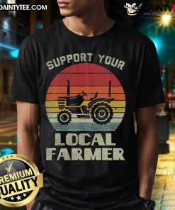 Retro farming truck at sunset on a t-shirt, showcasing local farmer support and vintage tractor design.