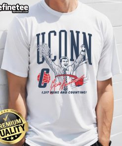 Cartoon of Geno Auriemma celebrating a win on a basketball coach t-shirt, perfect for fans and sports enthusiasts.