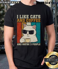 Vintage T-shirt featuring 'I Like Cats And Coffee' with a playful design and three people enjoying coffee and cats.