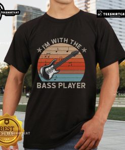 Alt Text: Nice I'm With The Bass Player T-Shirt featuring a guitarist silhouette against a sunset, perfect for music lovers.