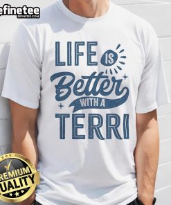 Person wearing a 'Nice Life Is Better With A Terri' T-shirt, showcasing a casual, uplifting lifestyle in a vibrant setting.