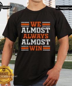 Funny orange t-shirt for football lovers, featuring 'We Almost Always Almost Win' slogan for retro-style fans.