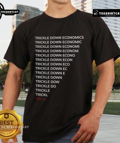 Robert Reich wearing a 'Trickle Down Economics' t-shirt, promoting economic equality and critiquing economic policies.