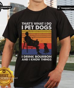 Vintage T-shirt featuring 'Nice Thats What I Do I Pet Dogs I Drink Bourbon And I Know Things' design for dog lovers.