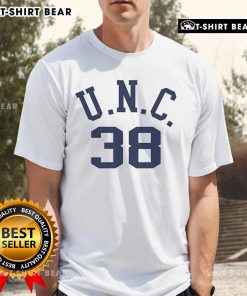 Alt Text: Bill Belichick wearing his dad's UNC t-shirt, showcasing a personal touch at a football event.