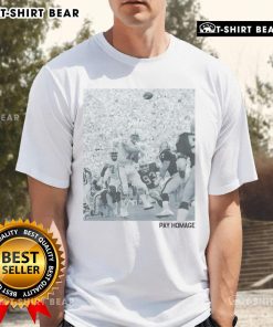 Official Dan Marino Pay Homage T-Shirt featuring Marino's iconic silhouette and team colors for football fans.
