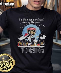 Official Florida Panthers Christmas T-Shirt featuring Peanut characters celebrating the holiday season.