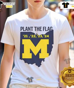 Official Michigan Plant The Flag 2024 T-Shirt featuring bold graphics for fans of Michigan sports and pride.