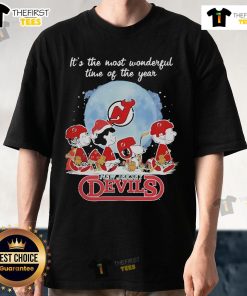 Official New Jersey Devils Christmas T-Shirt featuring Peanut characters celebrating the holiday season.