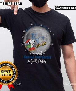 Official Santa Snoopy Merry Christmas T-Shirt for Kansas City Royals fans celebrating the holiday season.