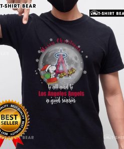 Santa Snoopy Merry Christmas T-Shirt featuring Los Angeles Angels logo for a joyful 2024 season celebration.