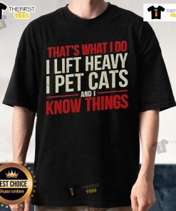 Alt Text: Official That's What I Do I Lift Heavy I Pet Cats And I Know Things T-Shirt design featuring bold text and a playful theme.