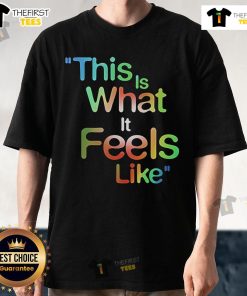 Alt Text: Official This Is What It Feels Like T-Shirt featuring bold graphics and a comfortable fit, perfect for fans.