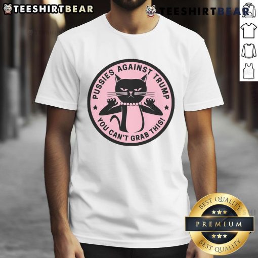Alt Text: Pussycats Against Trump T-shirt featuring playful cats and bold text: 'You Can't Grab This' for a humorous statement.
