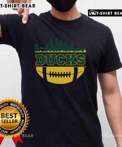 Top Oregon Ducks apparel featuring a city skyline design on a stylish football t-shirt for fans.