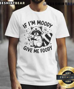 Funny raccoon T-shirt with 'Cute If I'm Moody Give Me Foody' slogan, perfect for animal lovers and humor enthusiasts.