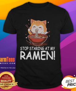Alt Text: Cute cat wearing a Stop Staring At My Ramen T-shirt, featuring funny noodles design, perfect for cat lovers and foodies.