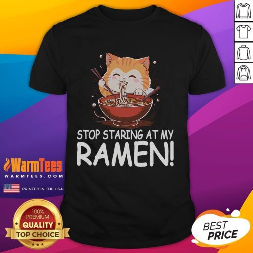 Alt Text: Cute cat wearing a Stop Staring At My Ramen T-shirt, featuring funny noodles design, perfect for cat lovers and foodies.