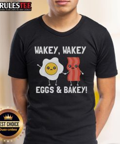 Adorable 'Wakey Wakey Eggs And Bakey' breakfast T-shirt featuring playful graphics of eggs and bacon for food lovers.