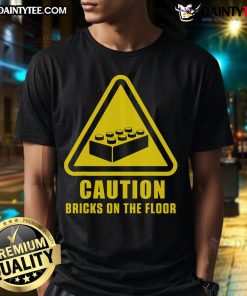 Funny caution Bricks On Floor graphic t-shirt for master builders, featuring playful building block designs. Perfect for construction fans!