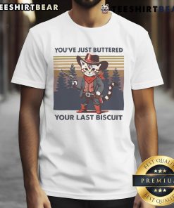 Alt Text: Funny cowboy cat graphic tee featuring You've Just Buttered Your Last Biscuit slogan, perfect for cat lovers.